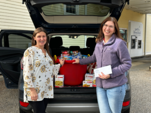 NBSB Employee Jessica Shimansky featured outside of the North Brookfield Branch assisting Christie Driscol from St. Joseph’s Parish with non-perishable food and monetary donations from NBSB’s Annual Food Drive Collection. Fundraiser.