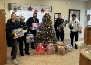 NBSB Employee Joseph Ribeiro featured inside of the West Brookfield Branch assisting the West Brookfield Police Department with toy and monetary donations from NBSB’s Annual Toy Drive Collection.